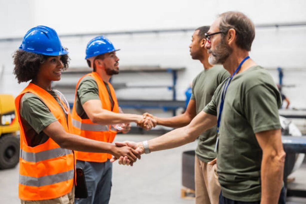 Tree service professionals shaking hands with clients during a project discussion in Bay Village, OH